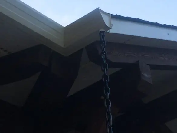 Dark-finished soffit under a deep roof overhang