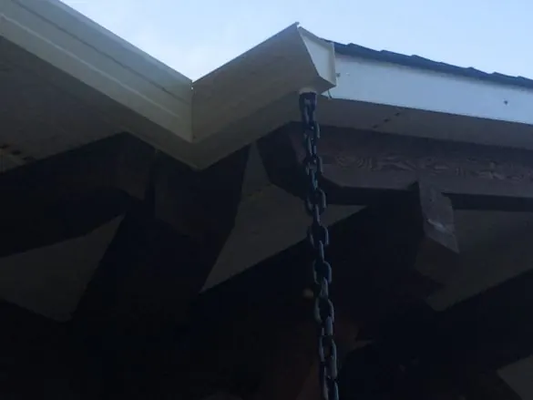 Dark-finished soffit under a deep roof overhang