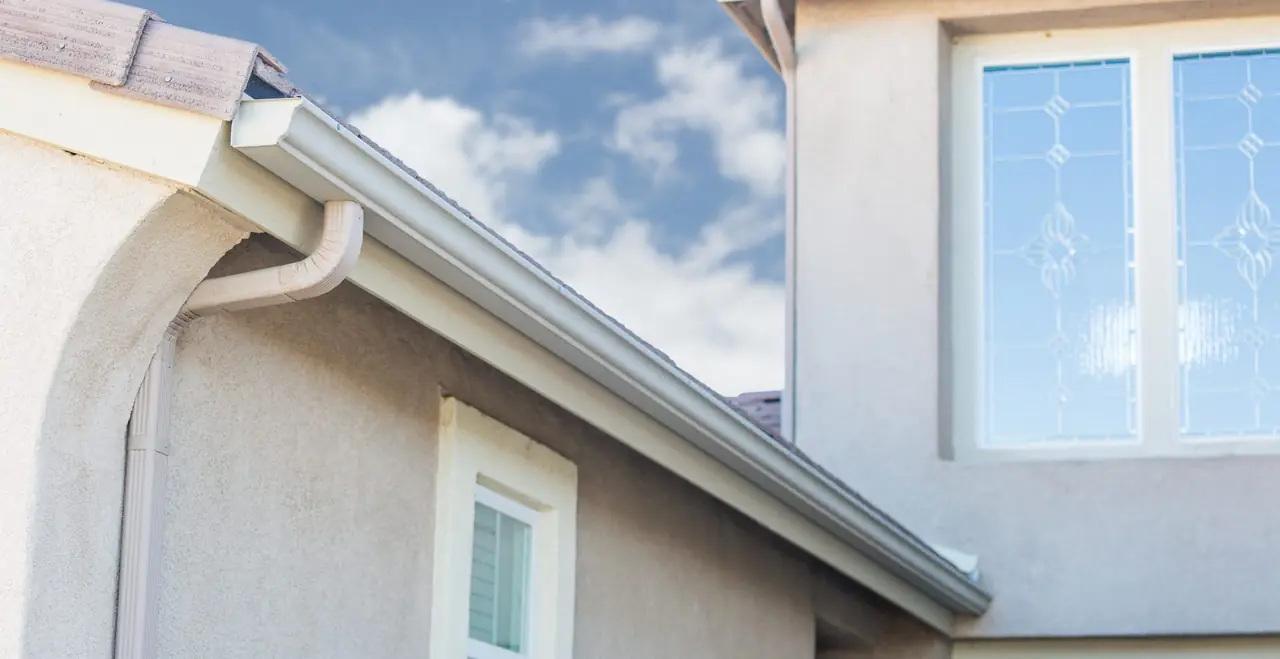 Gutter and eavestrough installation on a stucco home in Williams Lake