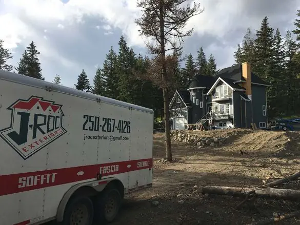 J-Roc Exteriors service trailer parked at a Williams Lake job site