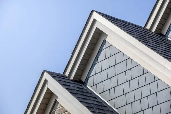 Clean white fascia and trim on a gable end